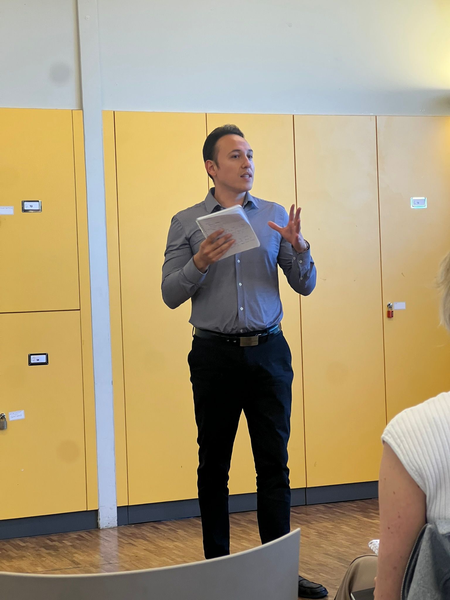 Impact Toastmasters members welcoming guests at a meeting